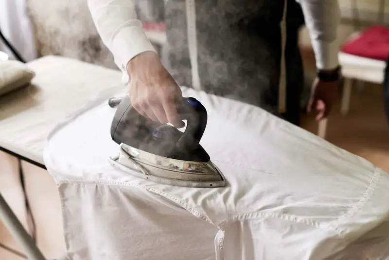 Steam iron pressing a crisp white shirt Laundry & Ironing 4U Hereford